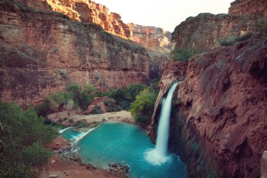 Hawasu waterfall in the Havasupai Reservation in Supai, Arizona in the Southwest corner of the Grand Canyon.  clipart