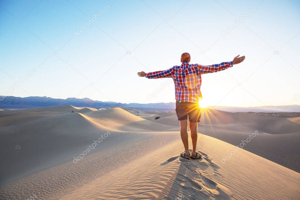 man Hike in sand desert 