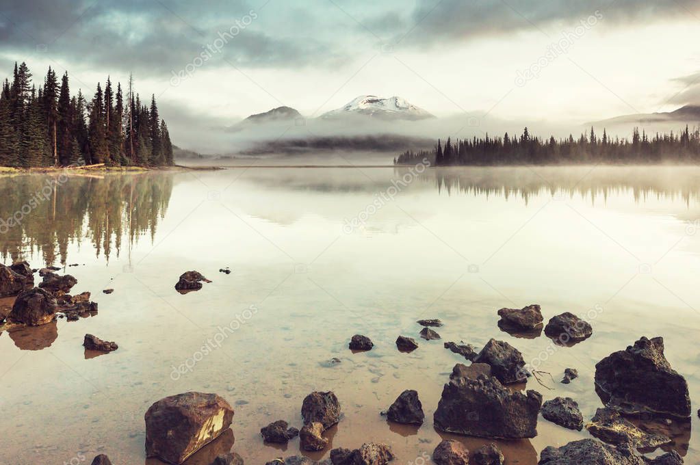 Serene beautiful lake in morning mountains, Oregon, USA.