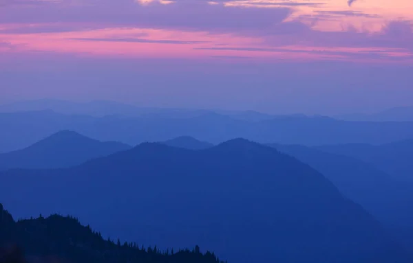 Beautiful natural background. Mountain silhouette at the sunset.