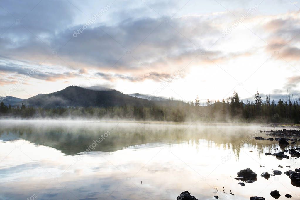 Serene beautiful lake in morning mountains, Oregon, USA.