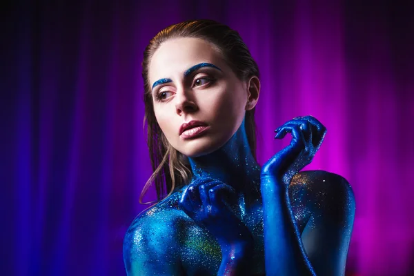 Portrait of beautiful woman painted with cosmic colors and spangled. — Stock Photo, Image