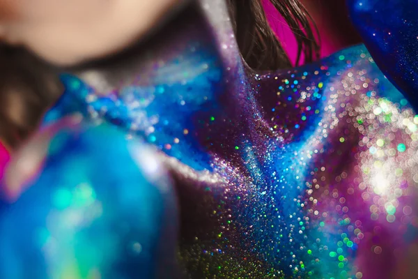 Portrait of beautiful woman painted with cosmic colors and spangled. — Stock Photo, Image