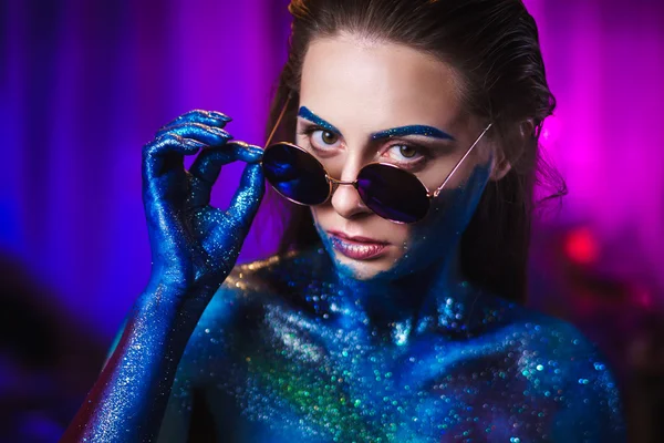 Portrait of beautiful woman painted with cosmic colors and spangled. — Stock Photo, Image