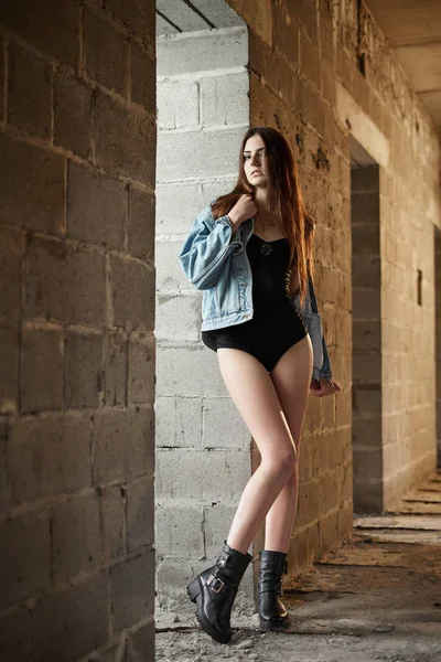 Beautiful girl wearing body and jeans jacket