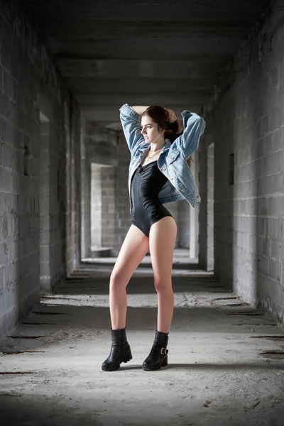 Beautiful girl wearing body and jeans jacket — Stock Photo, Image