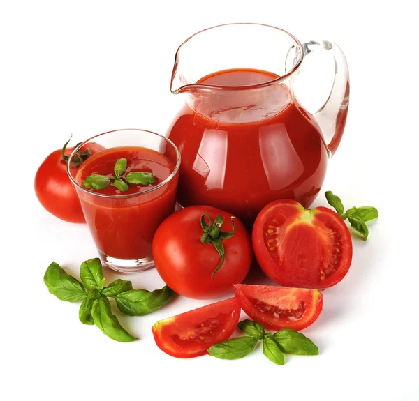 Tomato, glass and jug of tomato juice on white background — Stock Photo, Image