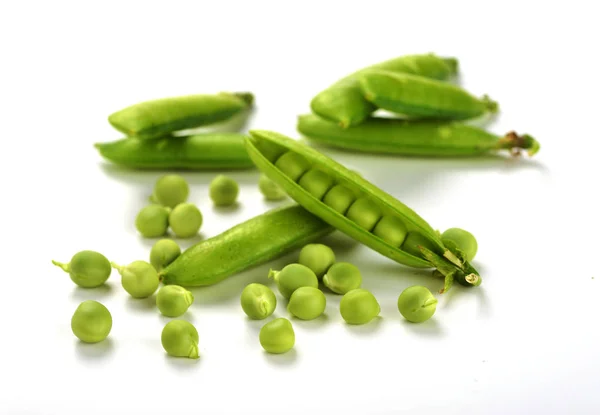 Pods of green peas isolated on a white background. Green ripe fr — Stock Photo, Image