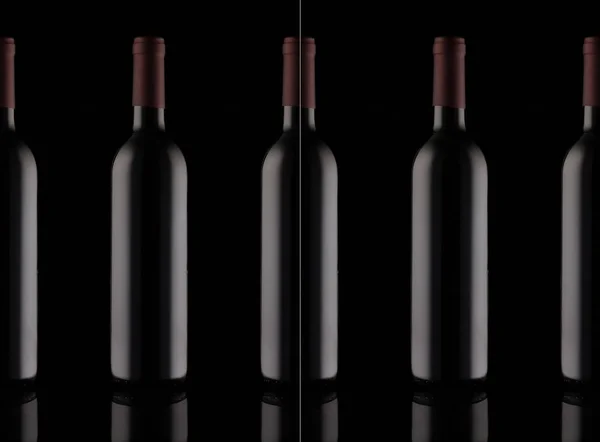 Fila di bottiglie di vino rosso — Foto Stock