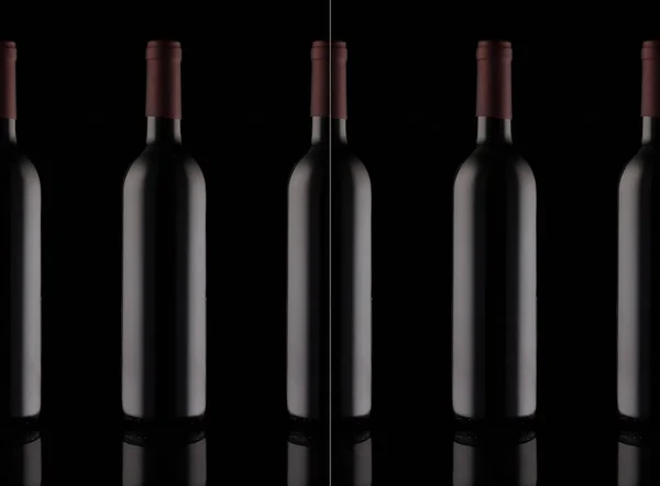 Row of bottles of red wine — Stock Photo, Image