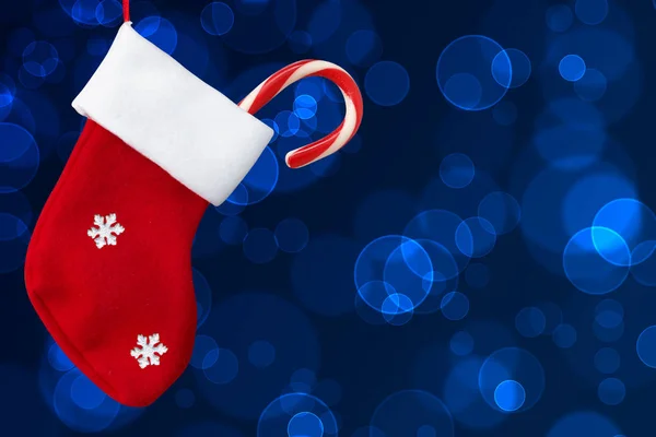 Calcetín rojo de Navidad y bombón de Navidad —  Fotos de Stock