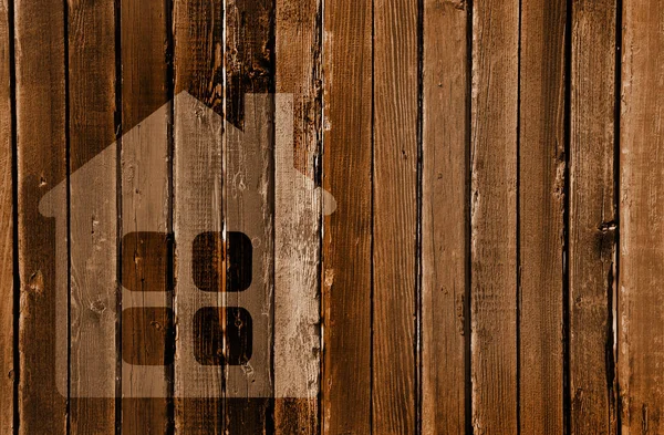 Silhouette of a house in a wooden wall — Stock Photo, Image