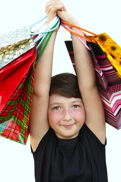 Kislány a bevásárló szatyrok-fehér háttér — Stock Fotó