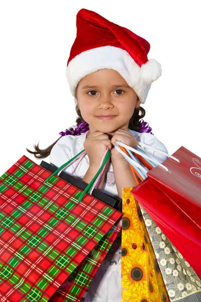 在与购物袋皮帽的小女孩。圣诞节 — 图库照片