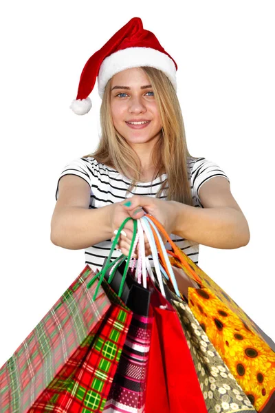 Niña con gorra de piel con bolsas de compras. Navidad — Foto de Stock