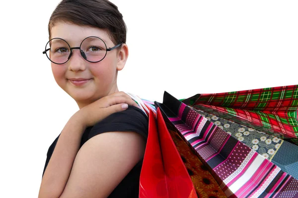 Bambina con borse della spesa su sfondo bianco — Foto Stock