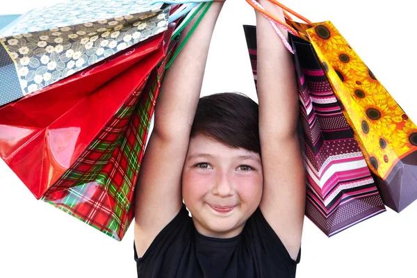 Kleines Mädchen mit Einkaufstaschen auf weißem Hintergrund — Stockfoto