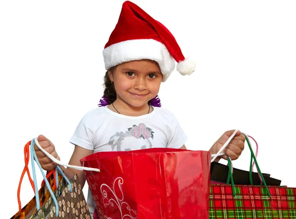 在与购物袋皮帽的小女孩。圣诞节 — 图库照片