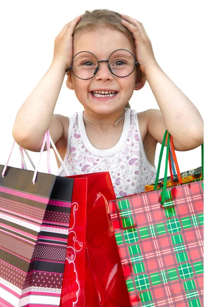 Meisje met boodschappentassen op witte achtergrond — Stockfoto