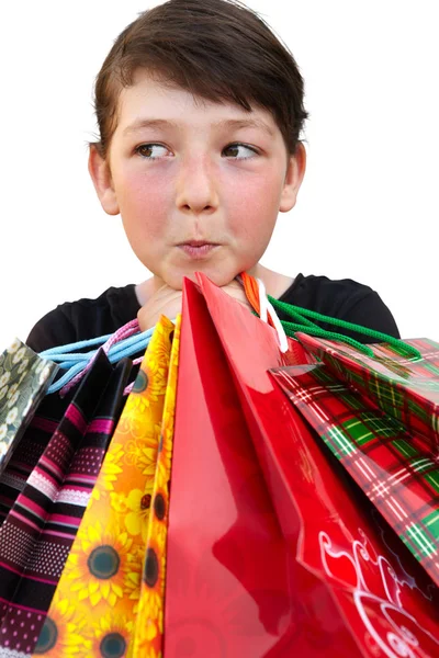 Niña con bolsas de compras sobre fondo blanco — Foto de Stock