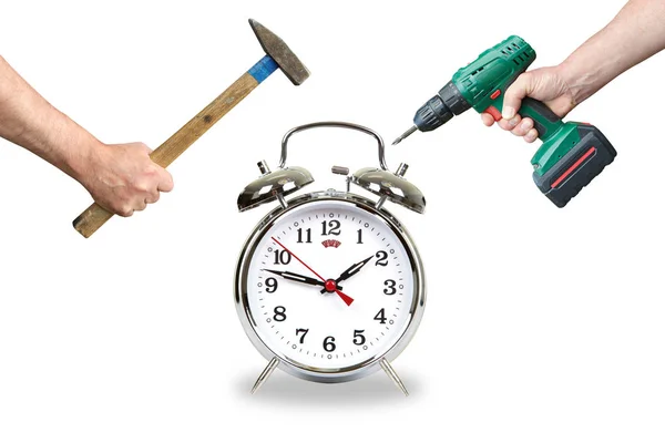 Hands with tool break the alarm clock — Stock Photo, Image