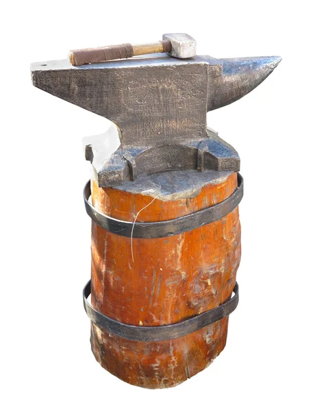 Anvil on a brown pedestal with a hammer isolated over white — Stock Photo, Image