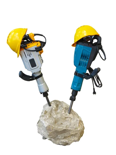 Construction concept - jackhammer in concrete and yellow helmet — Stock Photo, Image