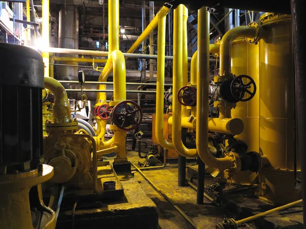 Oil pump, yellow pipes, tubes, machinery at power plant — Stock Photo, Image