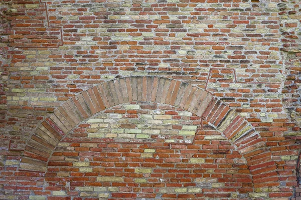 Antigua pared de ladrillo rojo con fondo de textura vintage arco — Foto de Stock