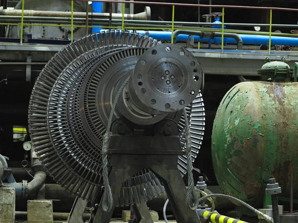 Power generator steam turbine in repair process, machinery, pipes, tubes, at an power plant