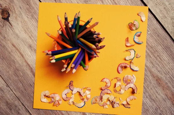 Pencil shavings on the yellow background — Stock Photo, Image