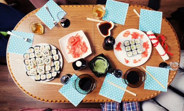 Table with sushi set and wine with glasses — Stock Photo, Image