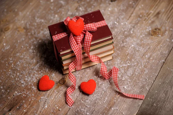 Books Wrapped Color Ribbon Red Hearts Adn Snow Wooden Table — Stock Photo, Image