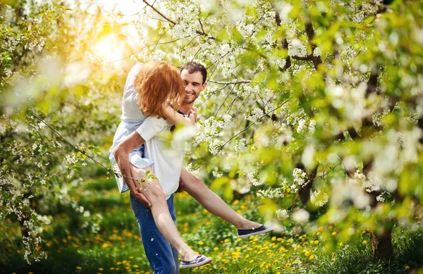 Young couple have fun in the garden — Stock Photo, Image