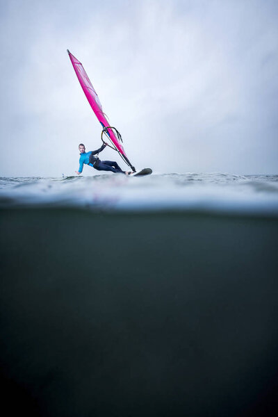 Waterline with frontview windsurfer — Stock Photo, Image