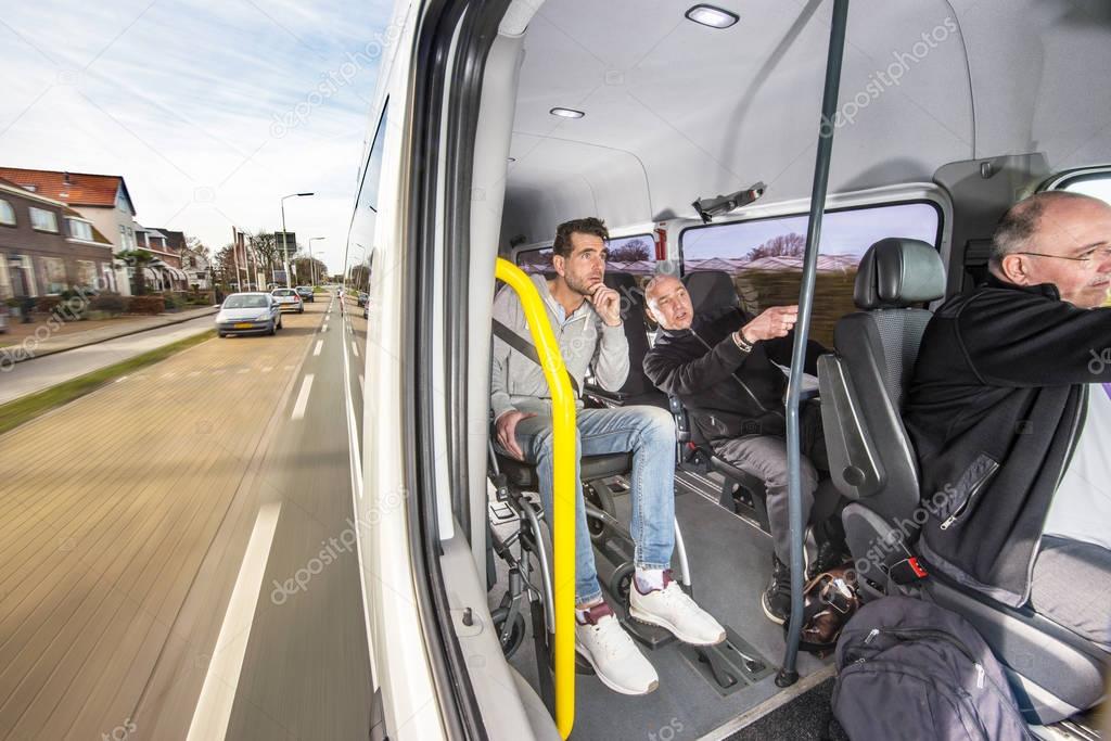 van, carrying a group of people