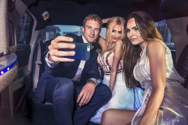 Taking a selfie in the back of a limousine — Stock Photo, Image