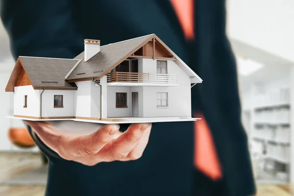Close-up image of businessman holding a 3d house, architecture project — Stock Photo, Image