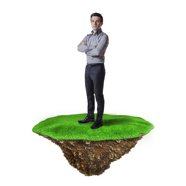 Business man on grass island, business concept — Stock Photo, Image