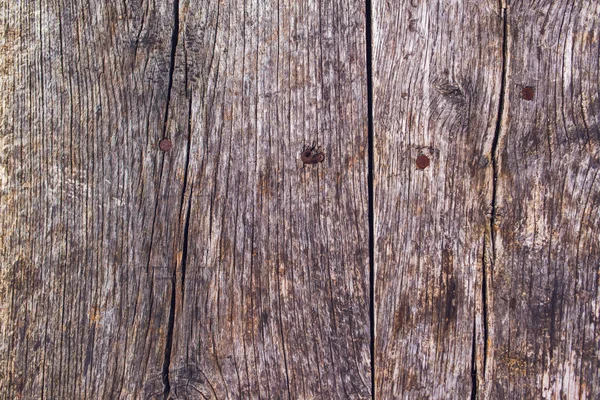 Superfície de madeira rústica com unhas enferrujadas — Fotografia de Stock