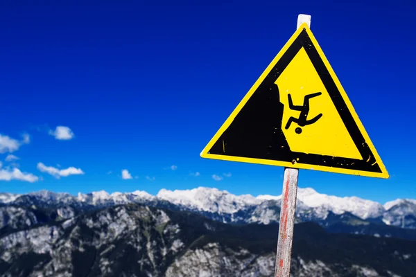 Warning sign - possible fall from the mountain cliff — Stock Photo, Image