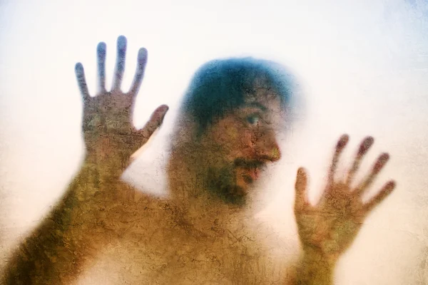 Trapped man, back lit silhouette of hands behind matte glass — Stock Photo, Image