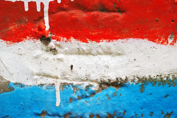 Bandeira branca e azul vermelha pintada na parede — Fotografia de Stock