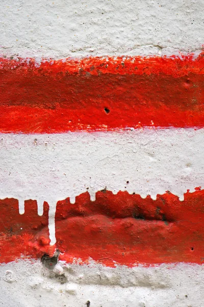 A falra festett vörös-fehér csíkos — Stock Fotó