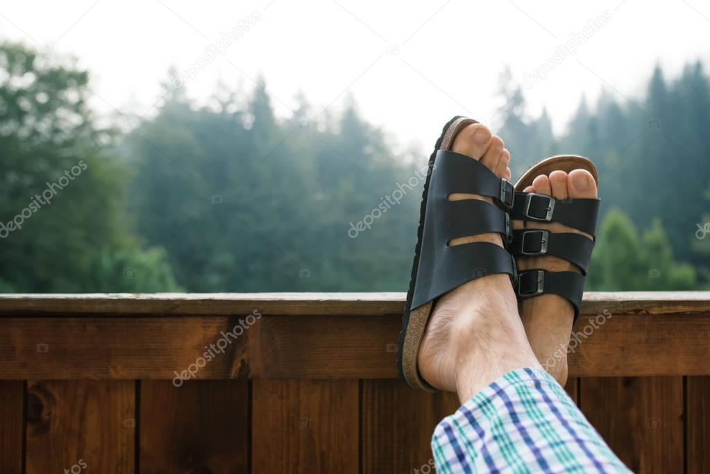 Relaxing at hotel balcony in misty morning