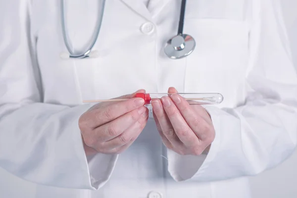 Female doctor preparing test tube for biological specimen — Stock Photo, Image