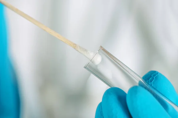 Cotton swab and DNA test tube macro — Stock Photo, Image