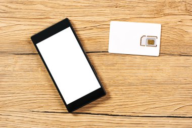 Ofis Masaları, üstten görünüm akıllı telefon ve SIM kart