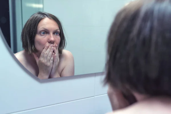 Fear of getting old, adult female in front of mirror — Stock Photo, Image