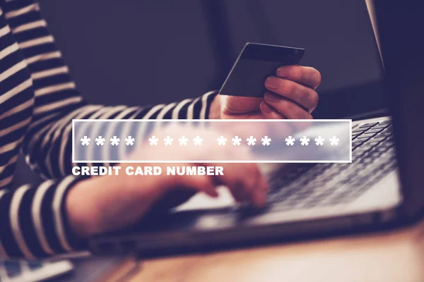 Woman typing credit card number for online shopping — Stock Photo, Image